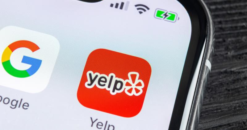 Google and Yelp apps on a phone screen